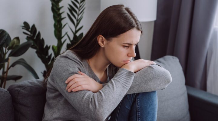 Sad woman sitting in contemplation
