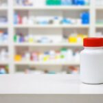 Iron Bridge - Gas Station Heroin 7-OH What You Need to Know About Over-the-Counter Drugs - Edited. An unidentified pill bottle sits on a counter with a backdrop of other medications.
